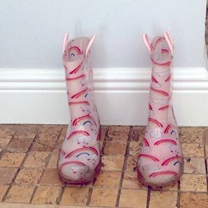 Pink rainbow rain boots that glow